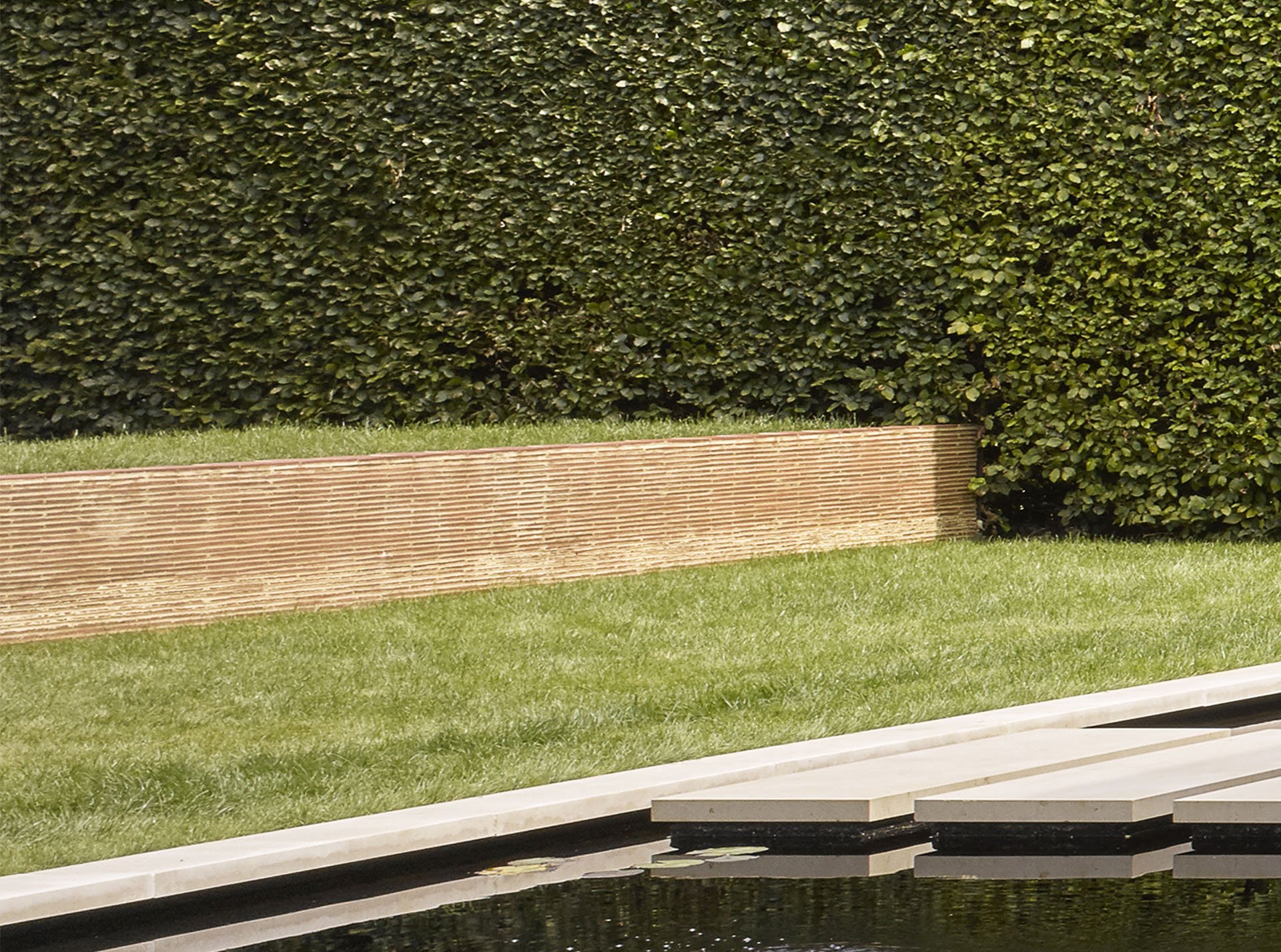 stacked clay creasing tiles create detail in a garden wall.jpg