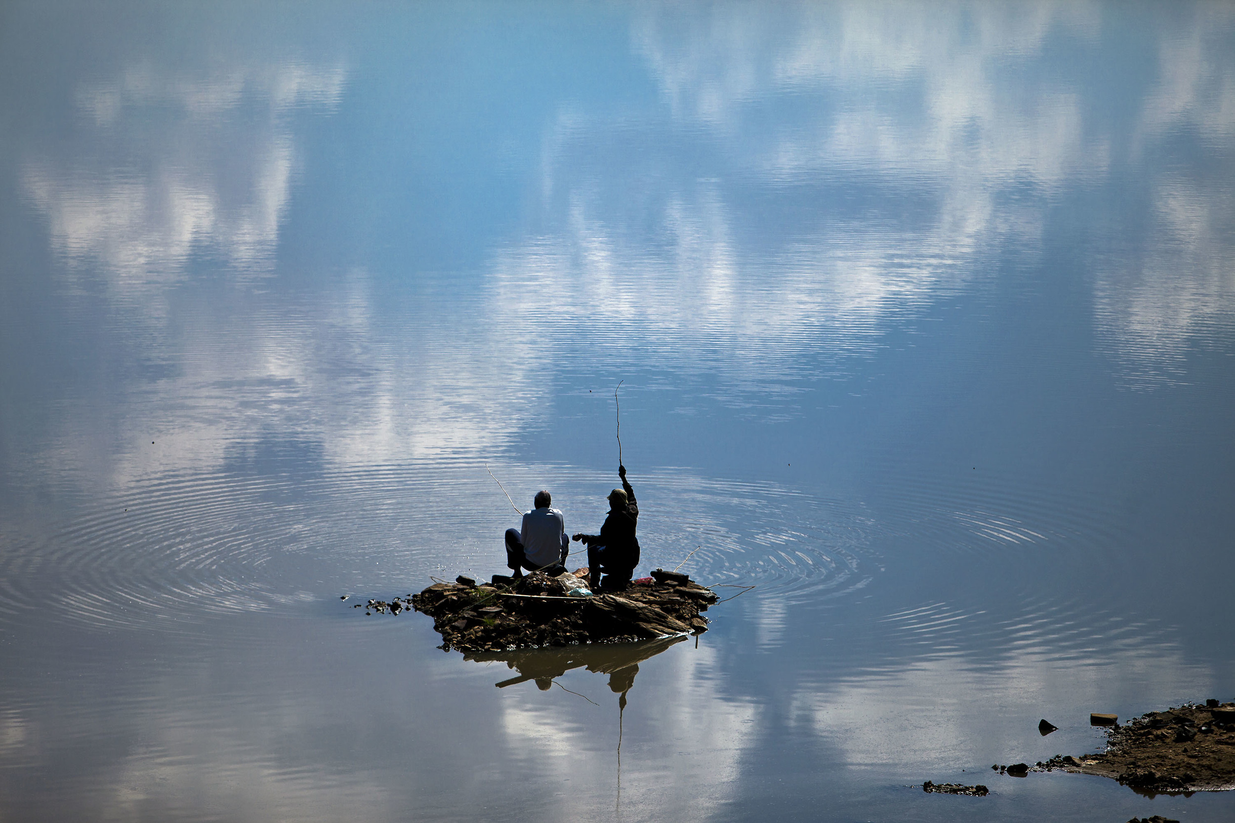 Fishermen at a lake in Limpopo, South Africa.