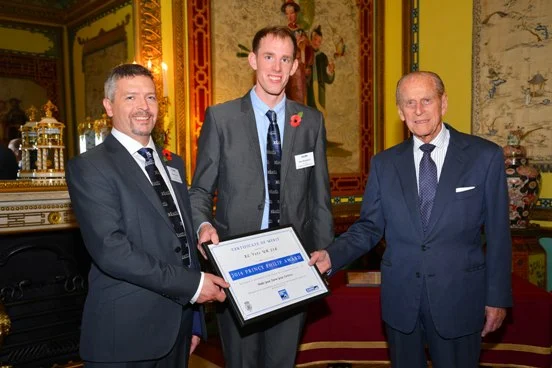 His Royal Highness presents the Certificate of Merit to XL Vets: left, Stuart Gough, Calweton Veterinary Group and Dan Humphries, Lambert Leonard and May
