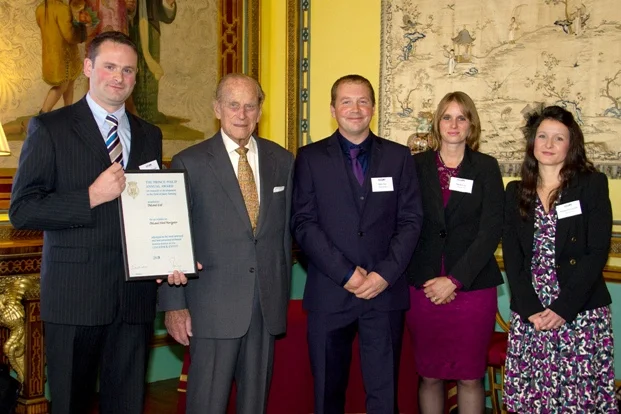 His Royal Highness presents the RABDF HRH Prince Philip Award to DeLaval’s Kieran FitzGerald, with right, Joanna FitzGerald and Peter and Sheila Cox who manage a 130 cow herd at Stoke Climsland, Cornwall and were the first producers to install Herd Navigator.