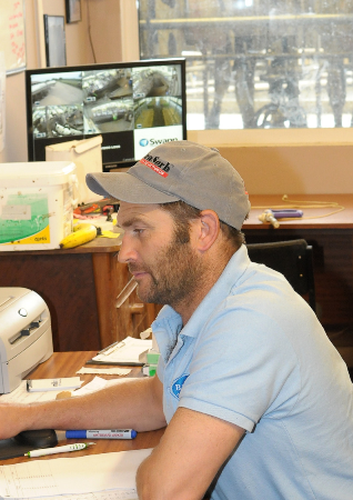 Neil Baker keeping tabs on heifer performance.