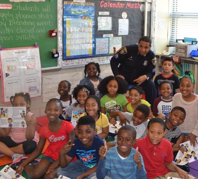 BALTIMORE CITY POLICE READing TO BCPS STUDENTS.