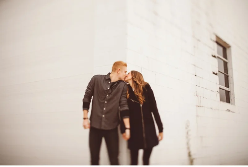 kissing couple by wall bourbonnais