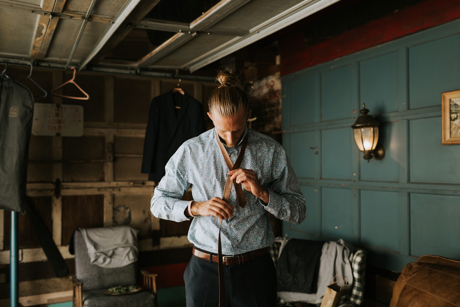 groomsman getting ready at vintage sundance studio in benton harbor michigan