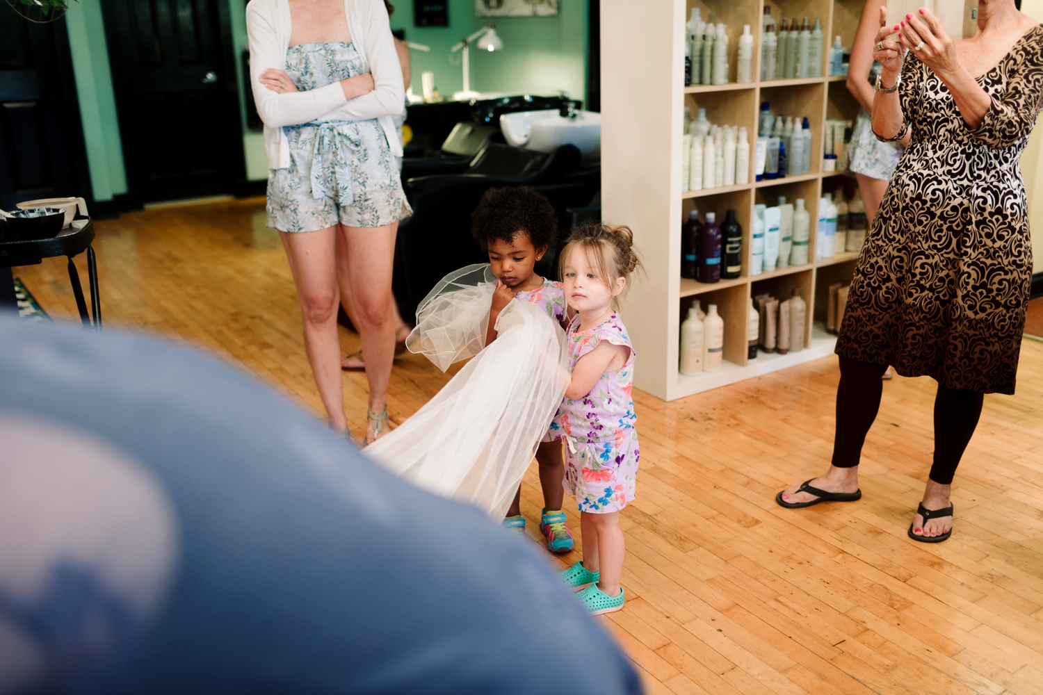 flower girls moment of holding the veil