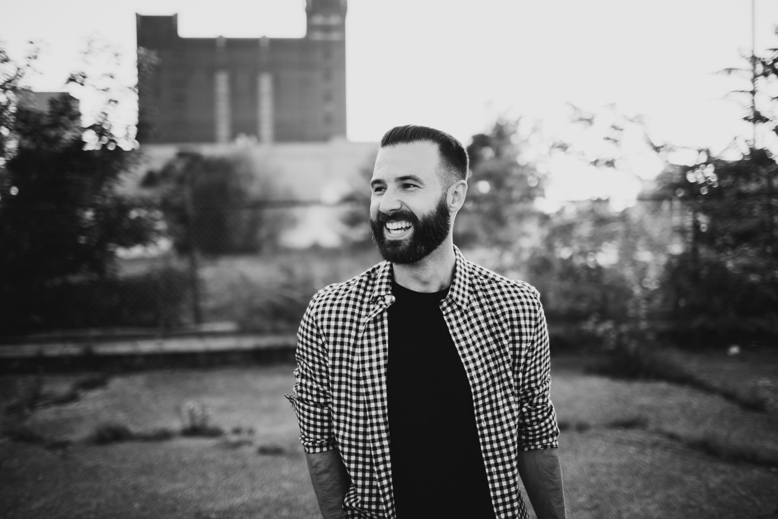 portrait of groom on detroit rooftop