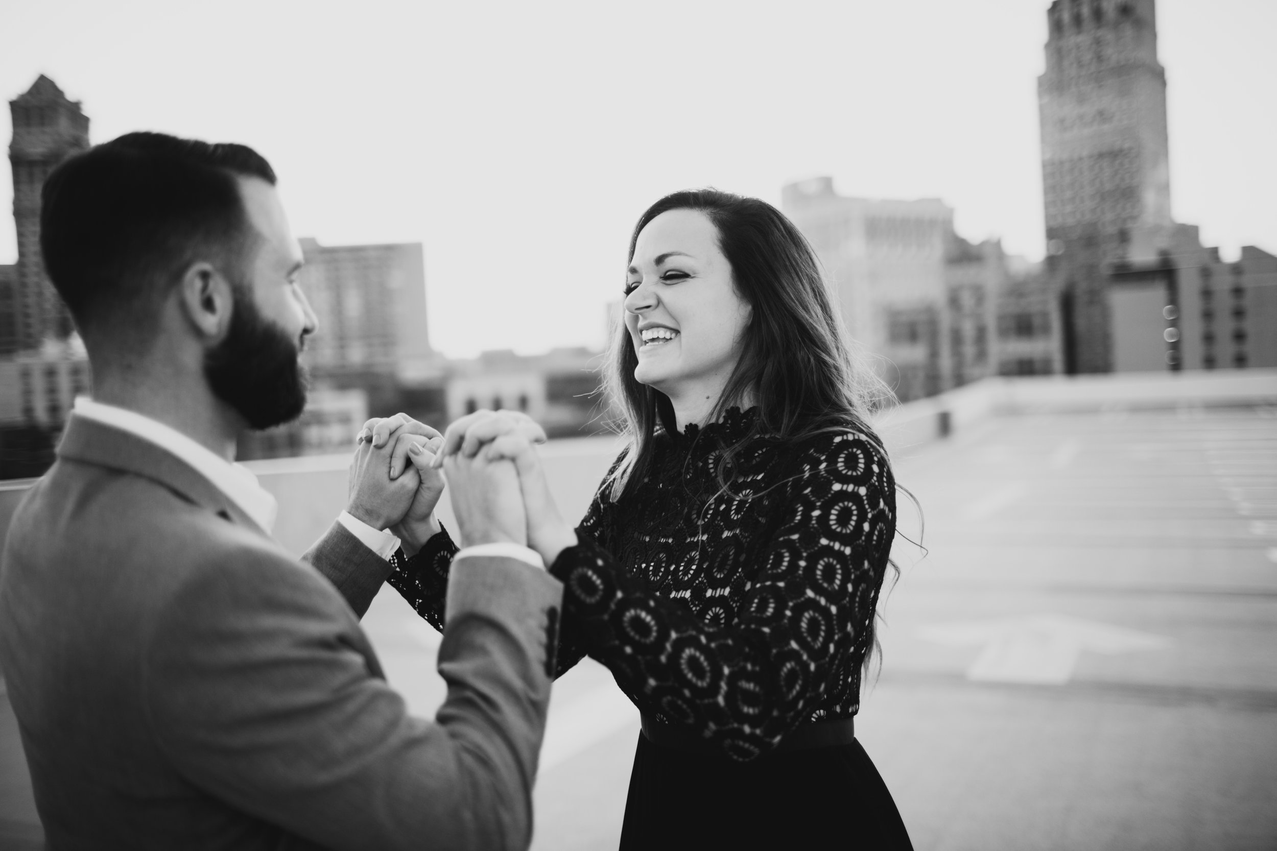 engagement session of rooftop with view of downtown detroit