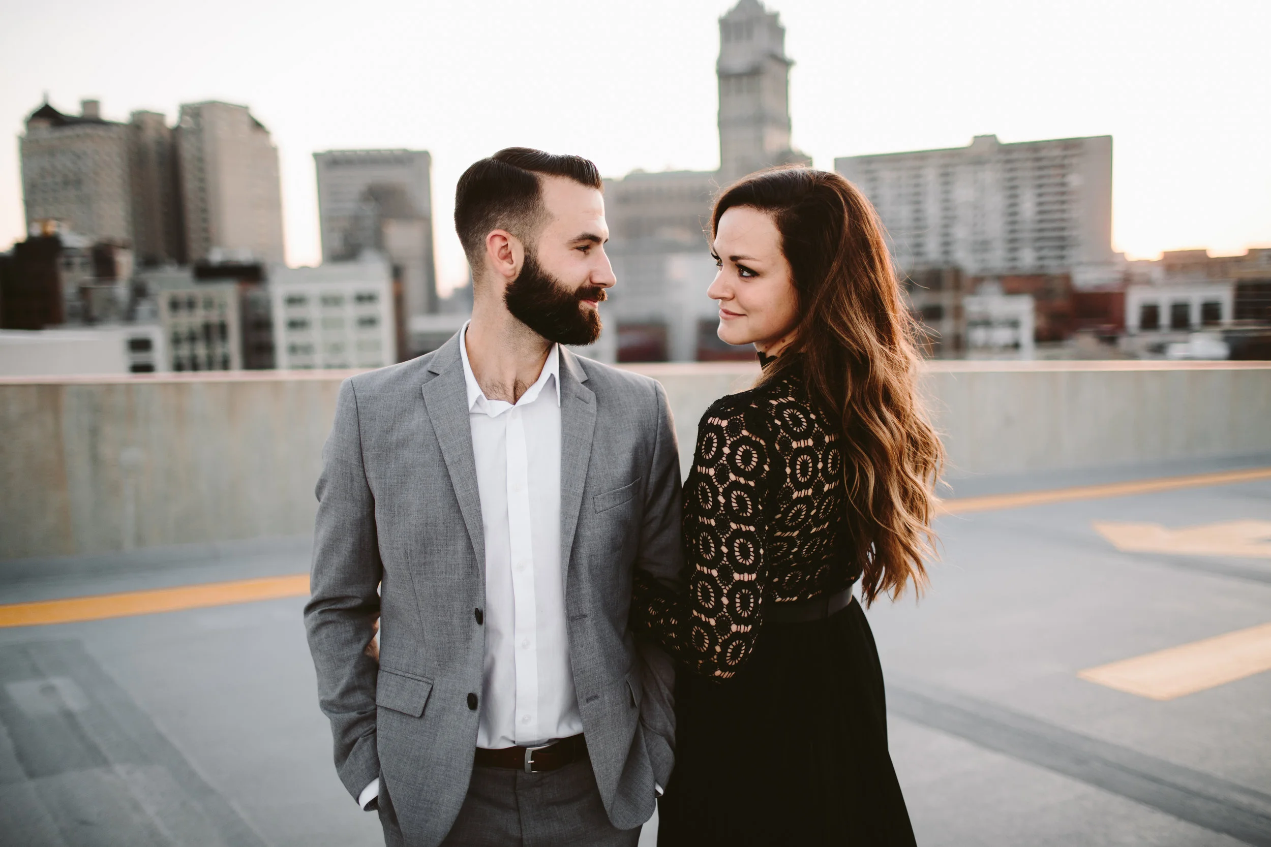 engagement session on parking garage rooftop at sunset in michigan