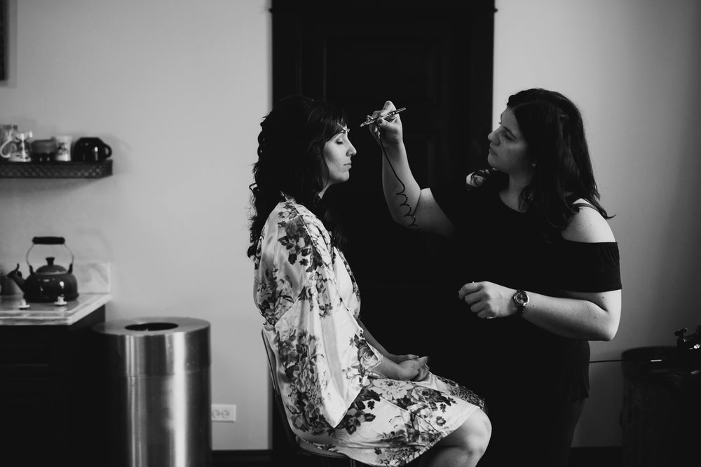 bride getting ready at firehouse chicago wedding venue