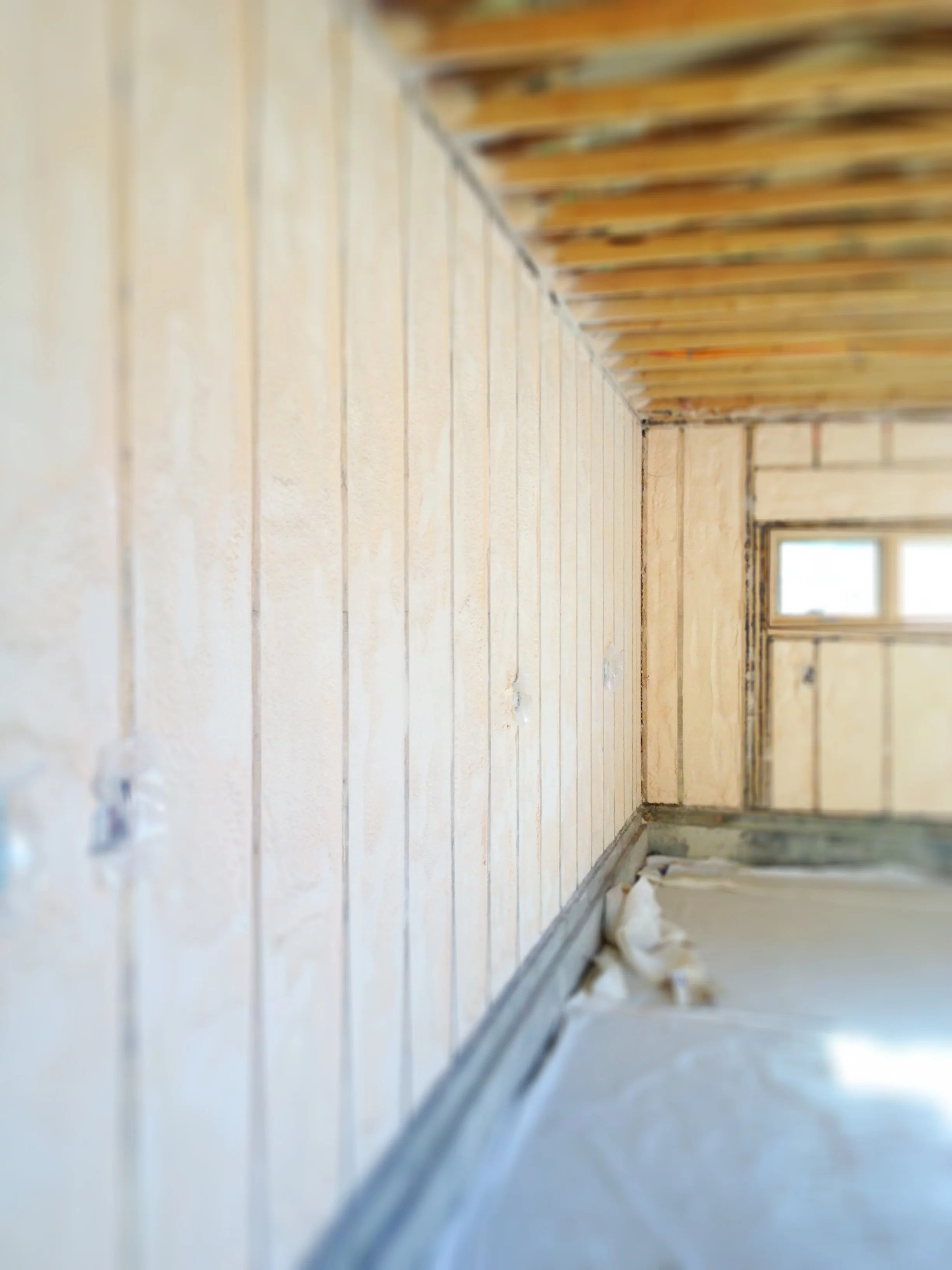 Spray foam insulation installed in garage walls.