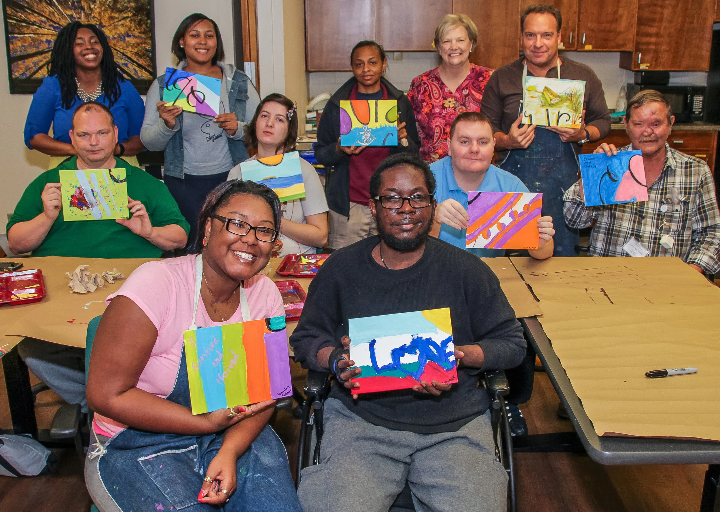 Back row (left to right): Shaquenta Byars, Occupational Therapy Assistant; Jada Risher, client; Gretchen Jackson, Intern; Janet Spires, Nurse Supervisor; Eric Kovak, client. Middle row: Clients John Fowler, Brittany Brooks, Tony Ramey, Ray Oswald. Front row: Clients Jamilah Robert, Levant Goodman.