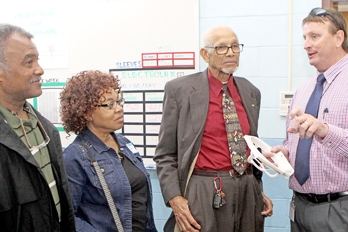 Seneca Mayor Dan Alexander, right, a business development specialist for South Carolina Vocational Rehabilitation’s Oconee and Pickens office, describes the services provided to local pastors, from left, Anthony Scott, Yvonne Scott and William Cureton Sr. Rex Brown | The Journal