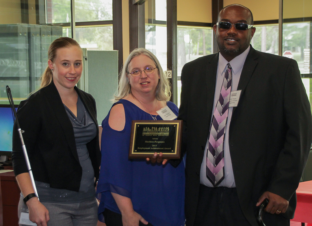 Sheldon Ferguson (right) accepts the Employment Achievement Award. On the left is Cali Sandel of the SC Commission for the Blind and in the center is Leslie Sibigtroth of Insignia Group, Ferguson’s employer.