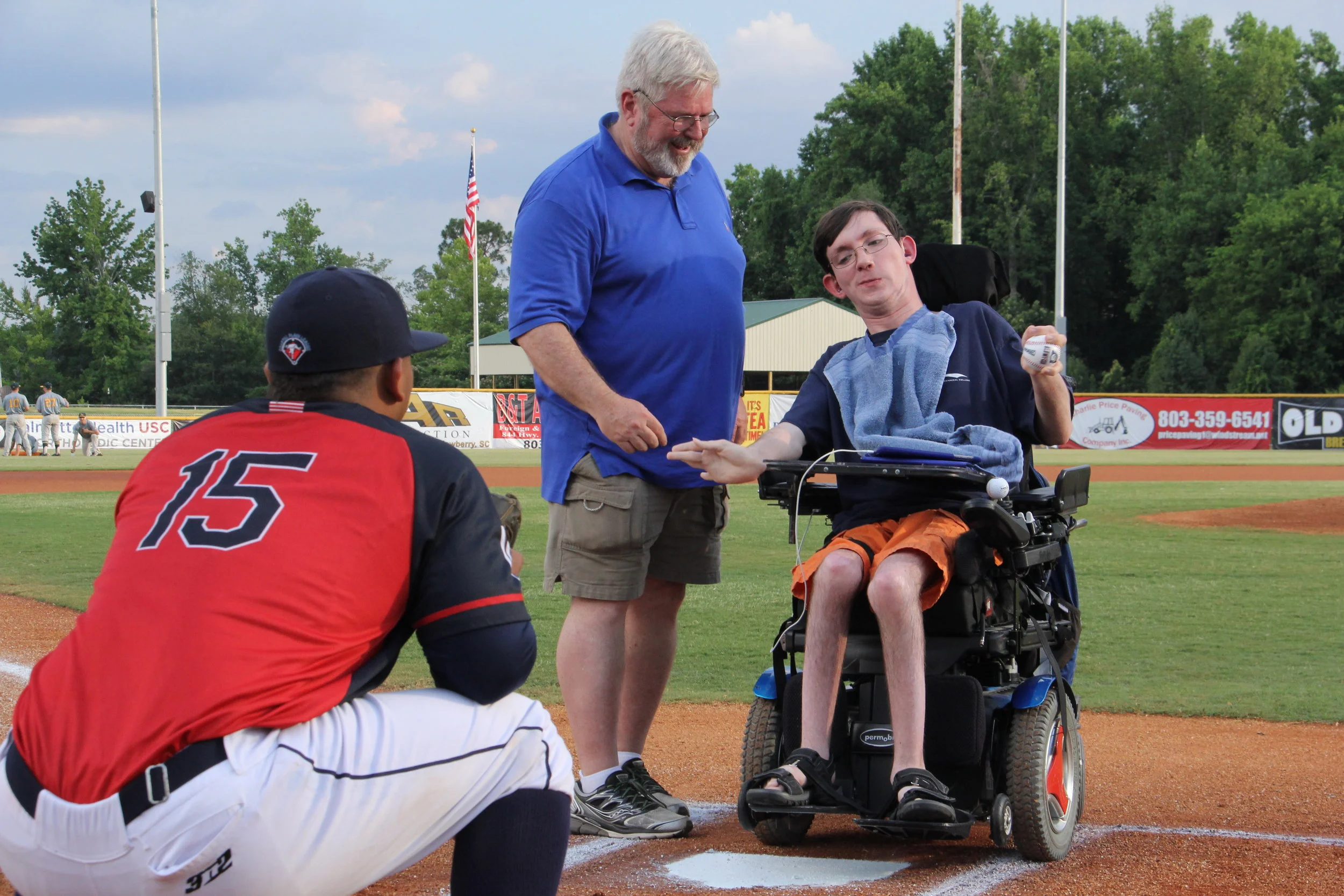 Lucien “Luke” McCurry prepares to throw the first pitch at a recent Lexington Blowfish game. Prior to the game, Luke and nine other young adults attending the Summer Transition Evaluation Program for Students (STEPS) at VR’s West Columbia Evaluation Center toured the Lexington County Baseball Stadium and met with various employees. They learned about jobs at the stadium, what’s involved in hosting a minor league baseball team, and various ways the stadium serves the community. Also pictured are Randal Ortiz (left), and Tom Langston (center), VR Job Preparedness Instructor.