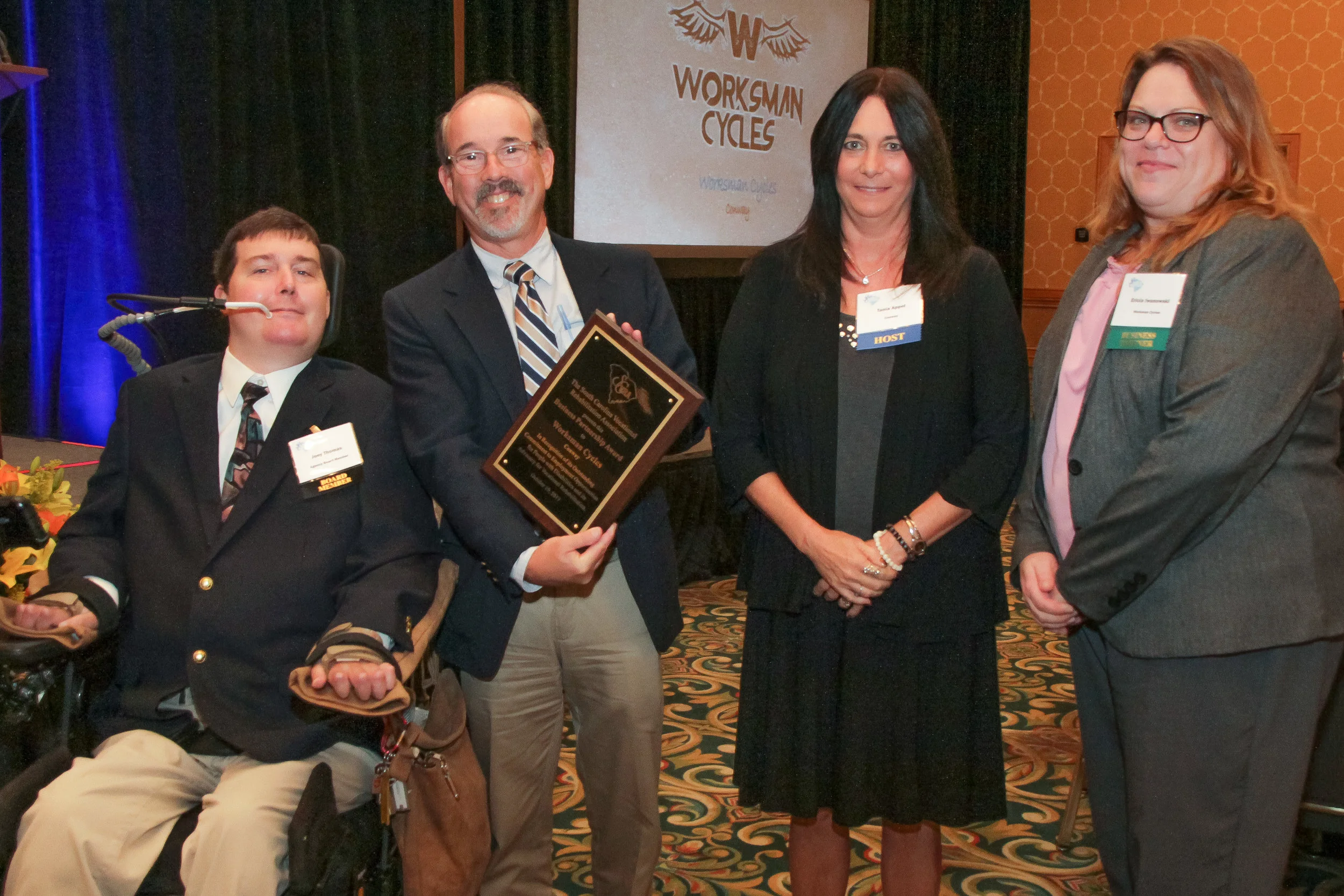 Wayne Sosin (second from left), President, and Erica Iwanowksi (right), Office Manager, of Worksman Cycles in Conway, receive the SCVRA Business Partnership Award from Joseph Thomas, SC State Agency of Vocational Rehabilitation Board Member, and Tania Appel, Conway Business Development Specialist.