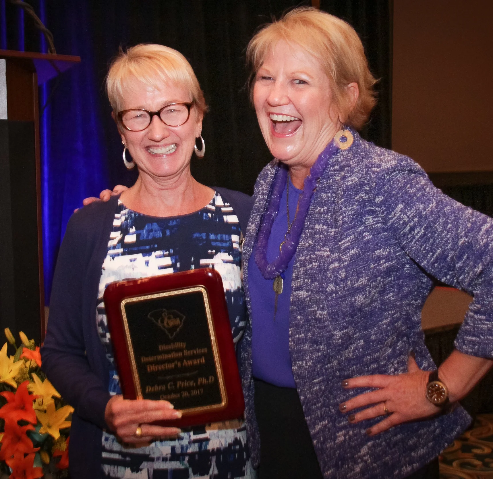 Debra C. Price (left), Ph.D, Disability Determination Lead Psychological Consultant, accepts the DDS Director’s Award from Shirley Jarrett, Director, Disability Determination Services.