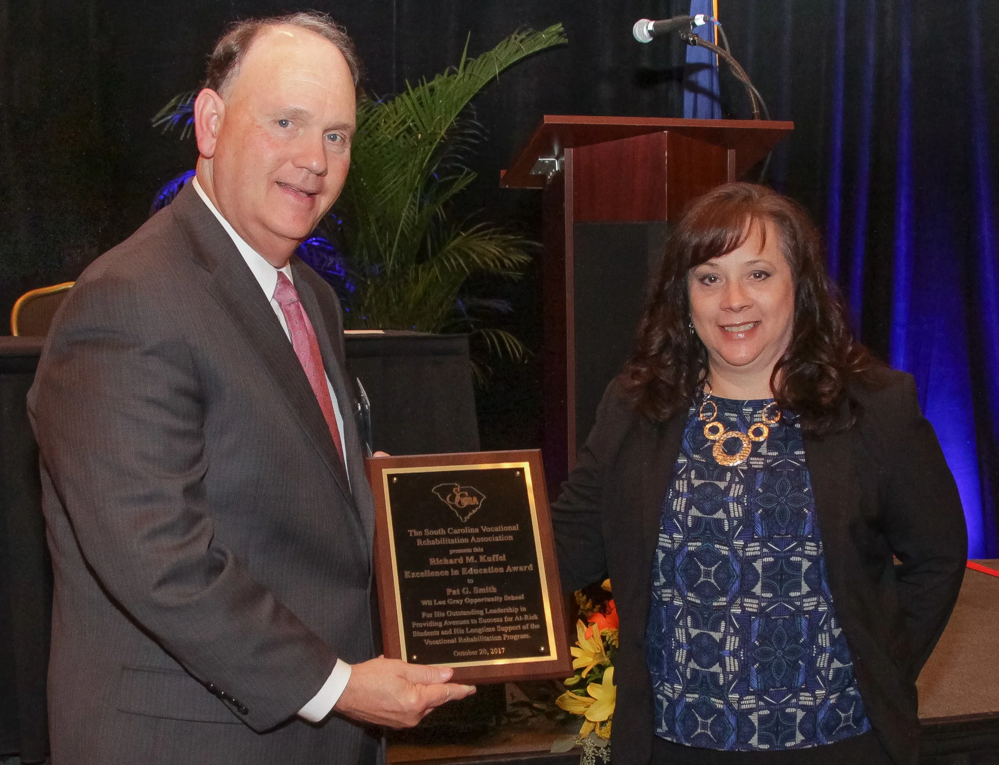 Pat G. Smith (left), Director of the Wil Lou Gray Opportunity School in West Columbia, receives the Richard M. Kuffel Excellence in Education Award from Laura Spears, VR Transition Services Coordinator.