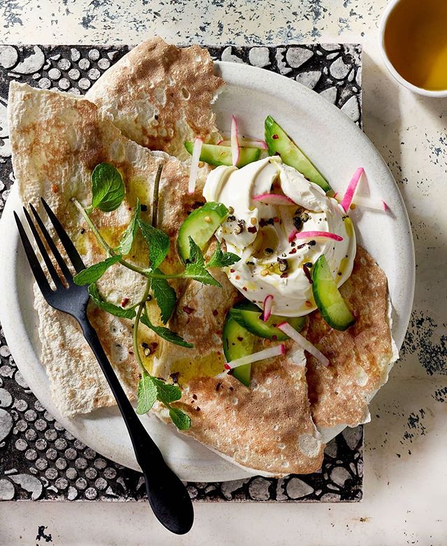 Kind of a black &amp; white theme....loved this tile on top of a distressed black &amp; white surface with black flatware. Can't remember exactly the food was....naan with goat cheese &amp; honey perhaps? #props #propstylist #propstyling #prophouse #