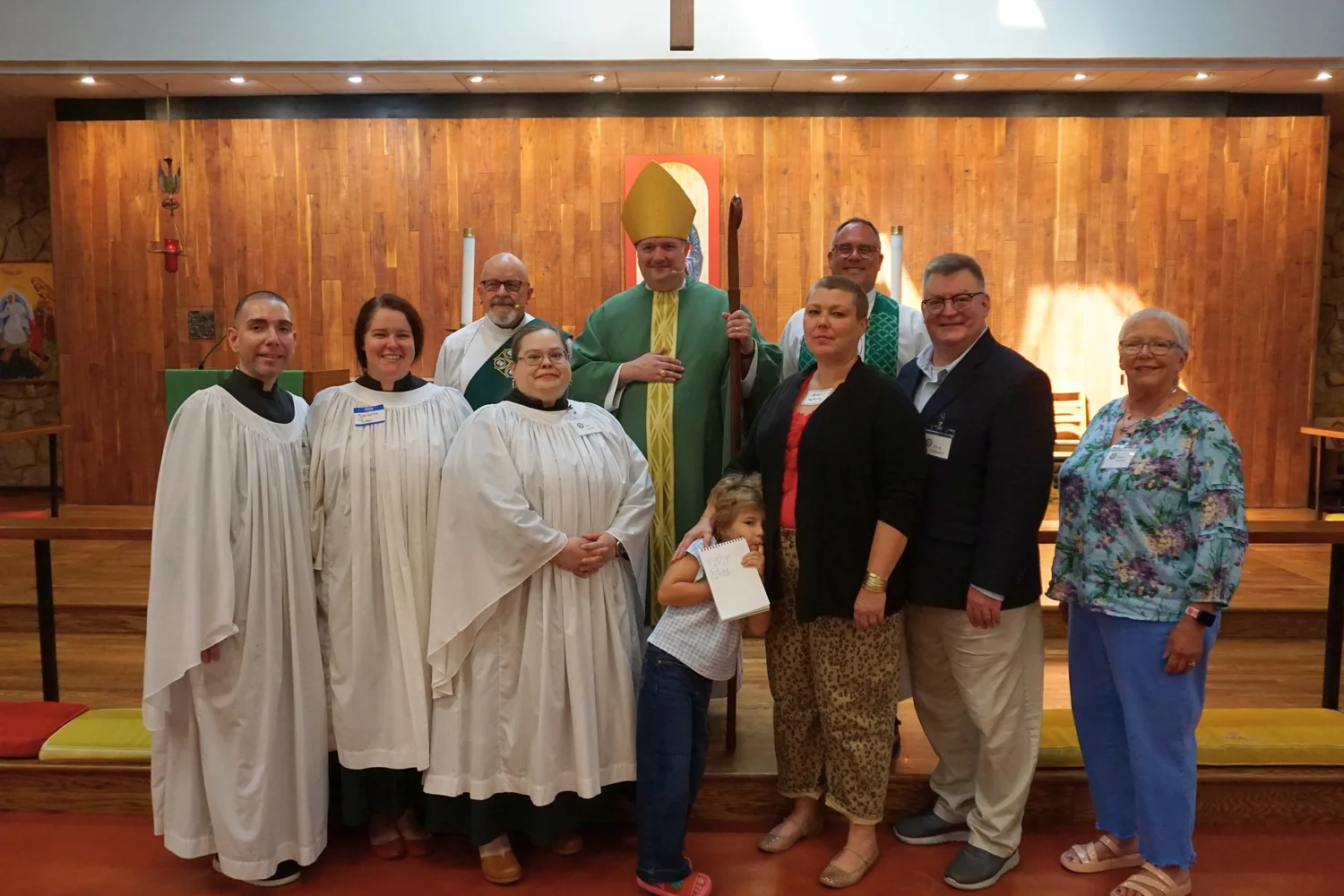 The six newly confirmed and received members with Bishop Poulson