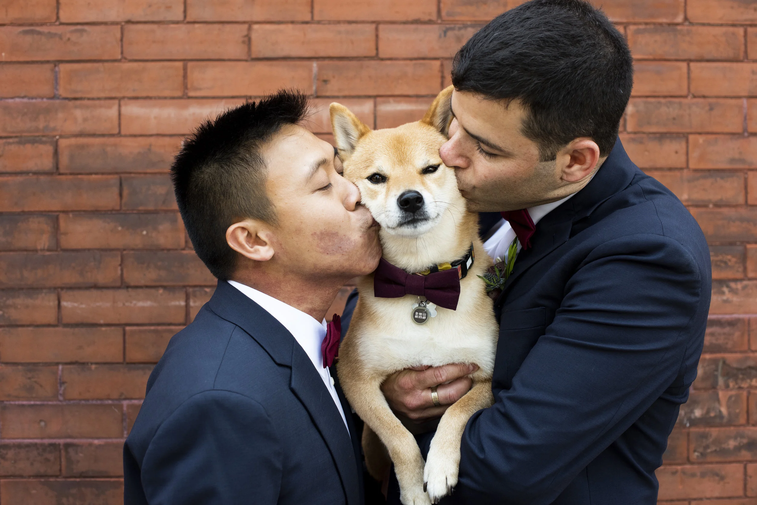 Chris and Eyal kiss a very special wedding guest before their ceremony at Aria . Wedding by: Melissa Hesse