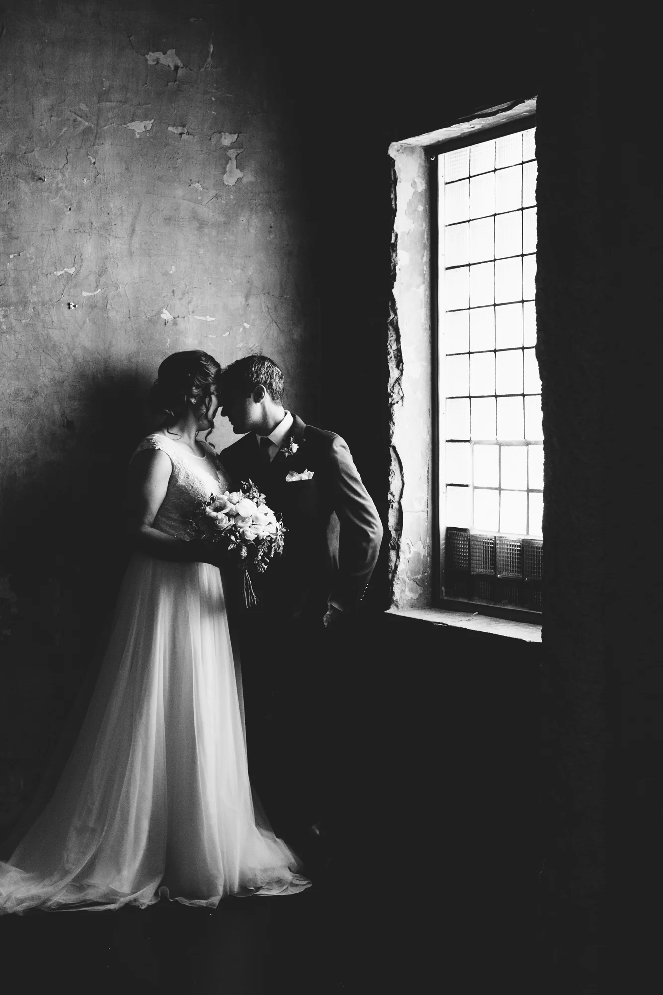 Laura and Domenic stand in gorgeous light at their wedding venue, Aria . Wedding by: Jess Ekstrand