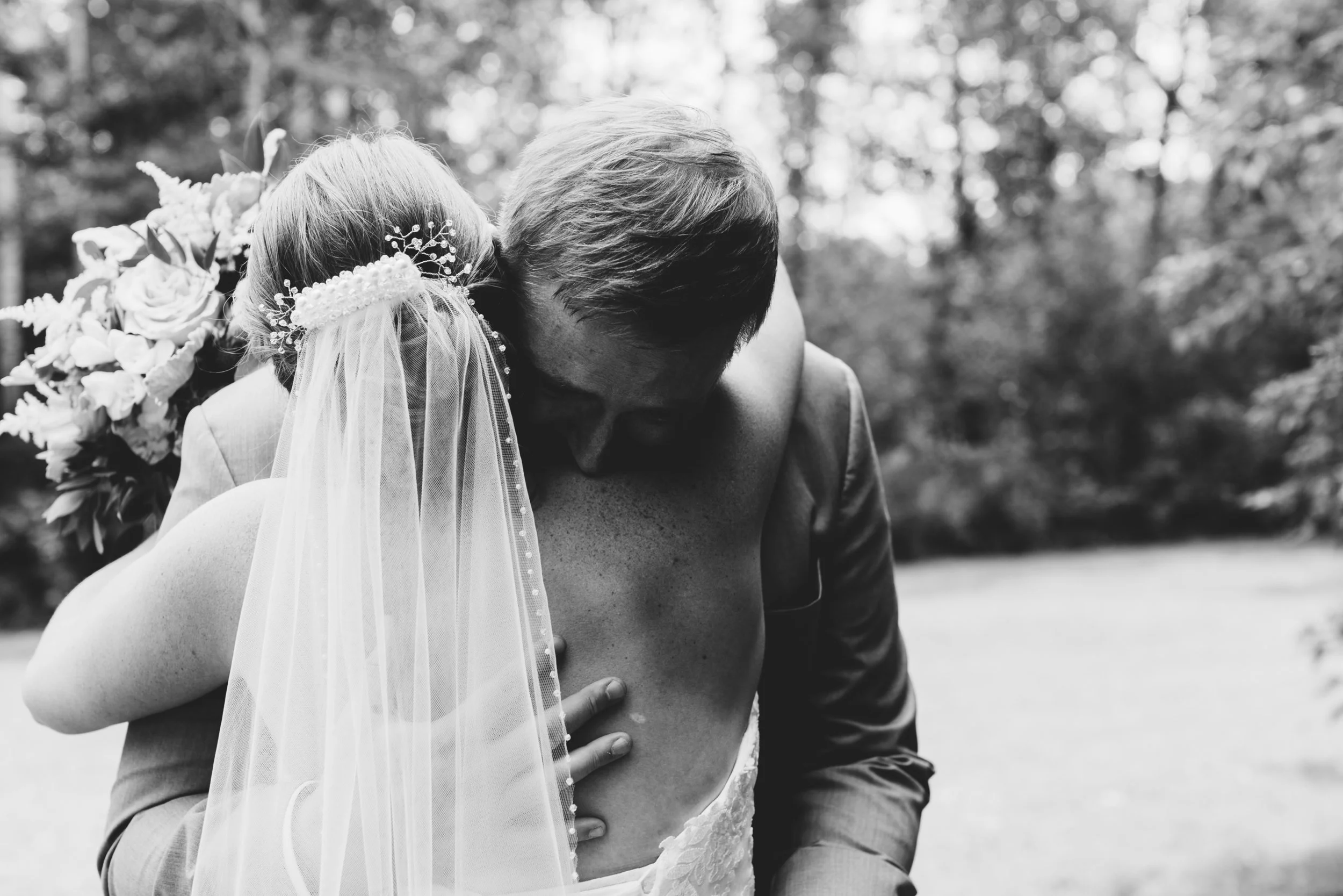Jesse and Ben share a heartwarming moment after their first look. Wedding by: Jess Ekstrand