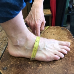 Measure your instep from inside to the outside of your foot. Measure from floor to floor.