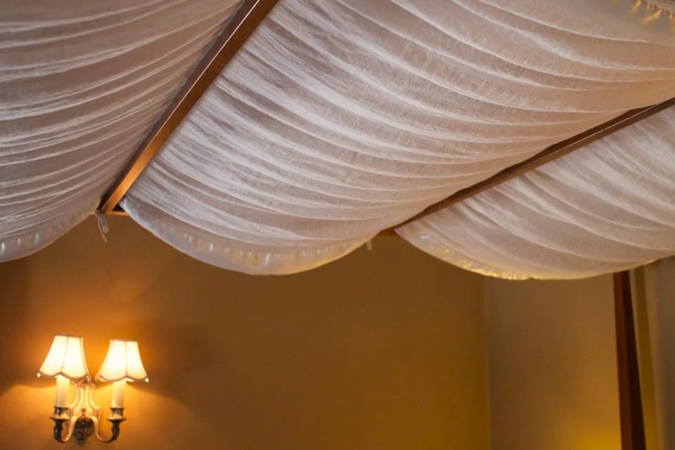 Pillowy and plush, the canopy of the queen, four-post bed lends an air of luxury to your accommodations in Room 3.