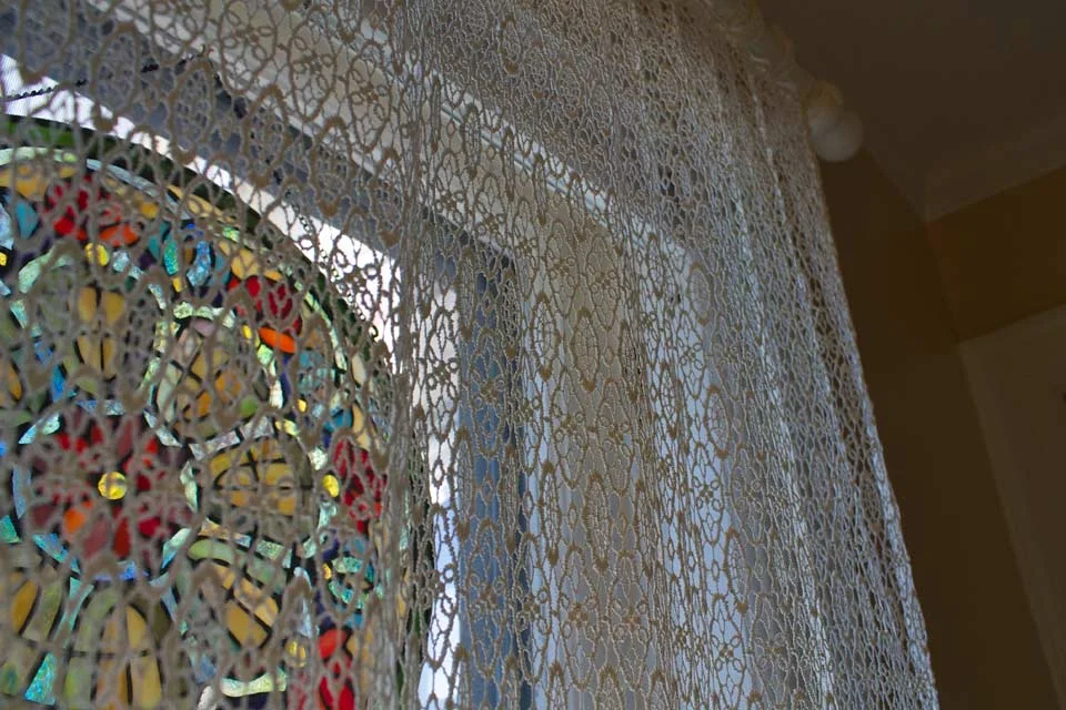 Sunlight through Stained glass decorations in bathroom window of Room 4.