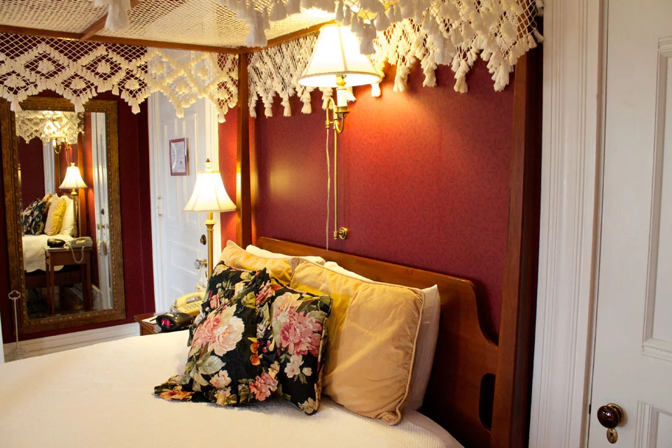 Plush beddings of queen, canopy bed in Room 4 of the Willard Inn, Burlington.