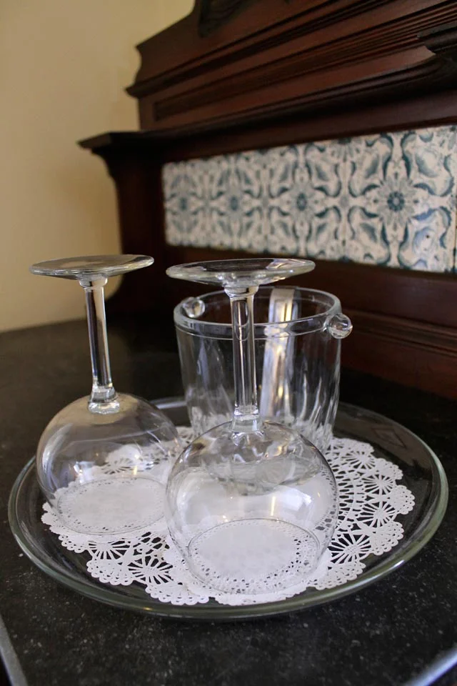 Wine Glasses await you on the marble and tile side buffet of the Suite Larkin.