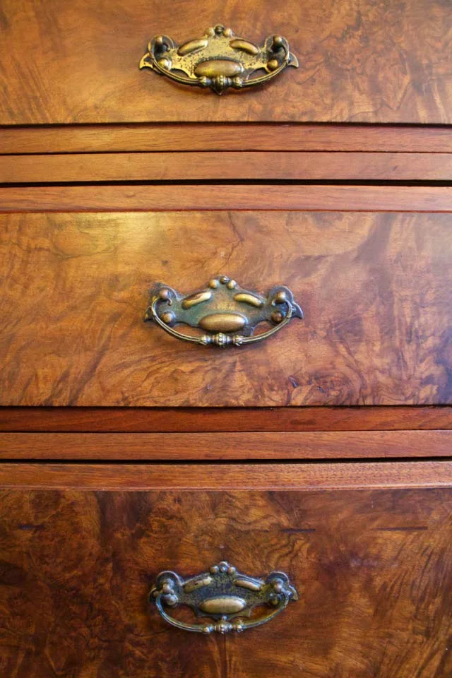 Maple Burl highlight the antique wooden dresser in the Rose Garden room.
