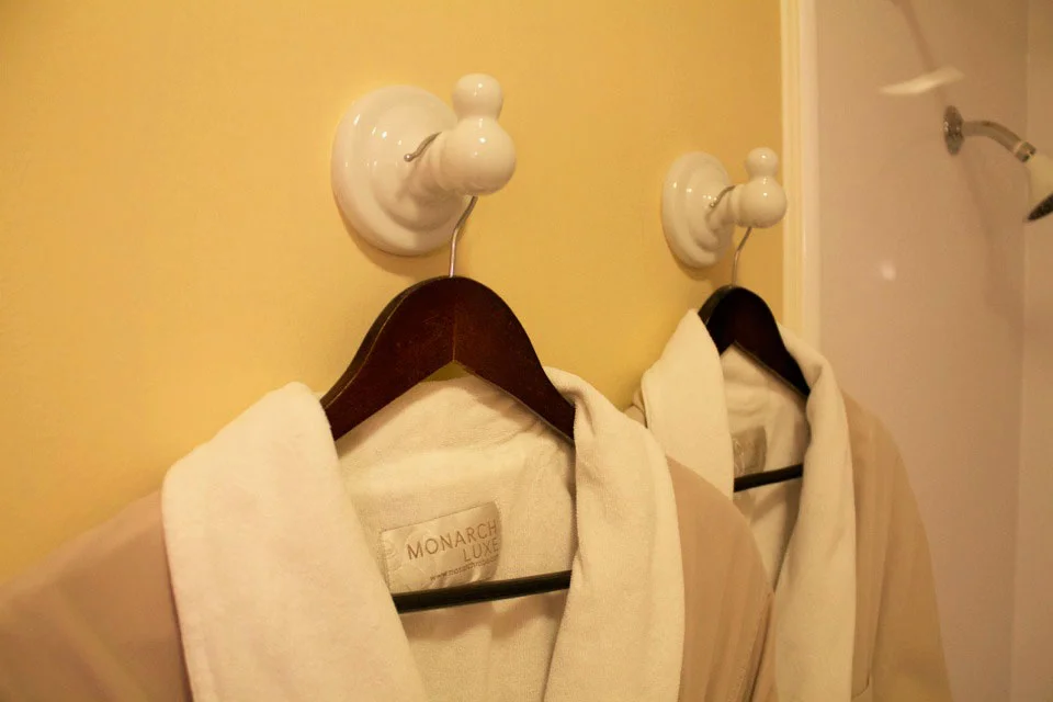 Soft bathrobes waiting to relax in while staying in the Tower Room.