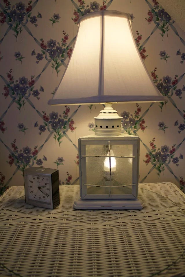 Lamp on wicker bedside table in Room 12 at WSInn, Vermont.