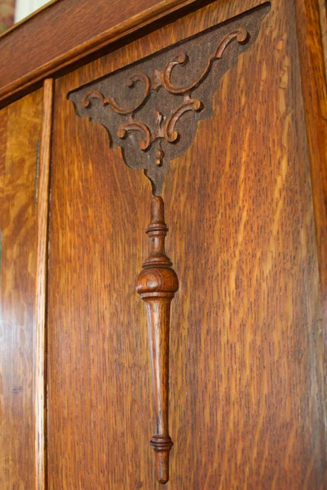 Carved oak detail on armoire in Room 16 at Burlington, VT B&B
