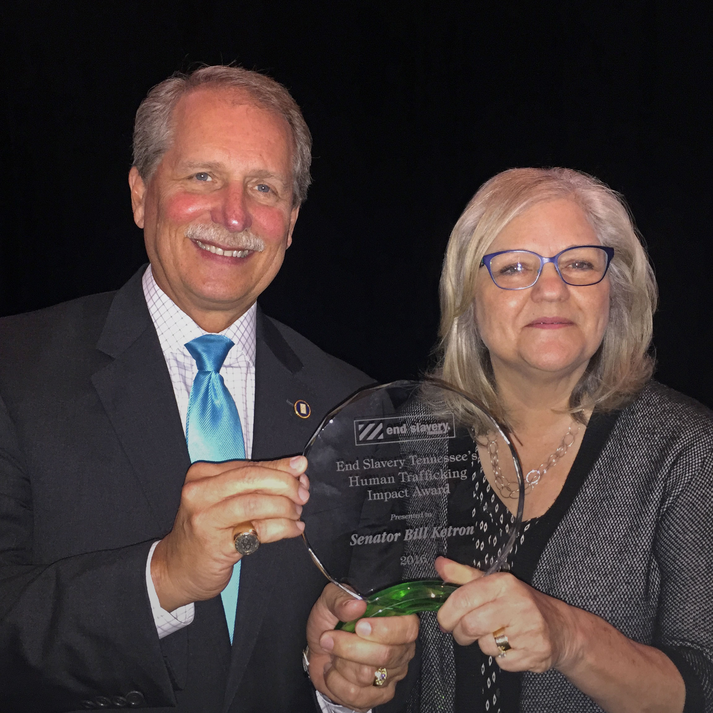 Founder and Executive Director Derri Smith presents the 2016 Human Trafficking Impact Award to Senator Bill Ketron