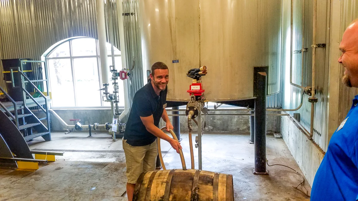 Austin filling the 53 gallon barrel with what will become M’tucci’s Private Select Maker’s Mark Bourbon.