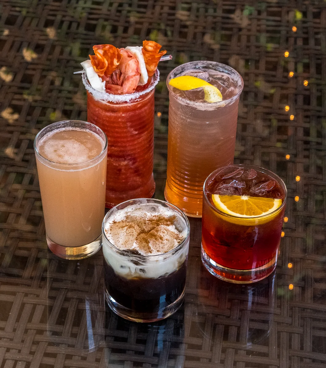 Clockwise from the front: Italian Iced Caffé, Bellini, Bloody Mary, Amalfi Coast High Ball, Negroni Sbagliato. Below: Aperol Spritz and the Mimosa Bar (Prosecco with a selection of juices).