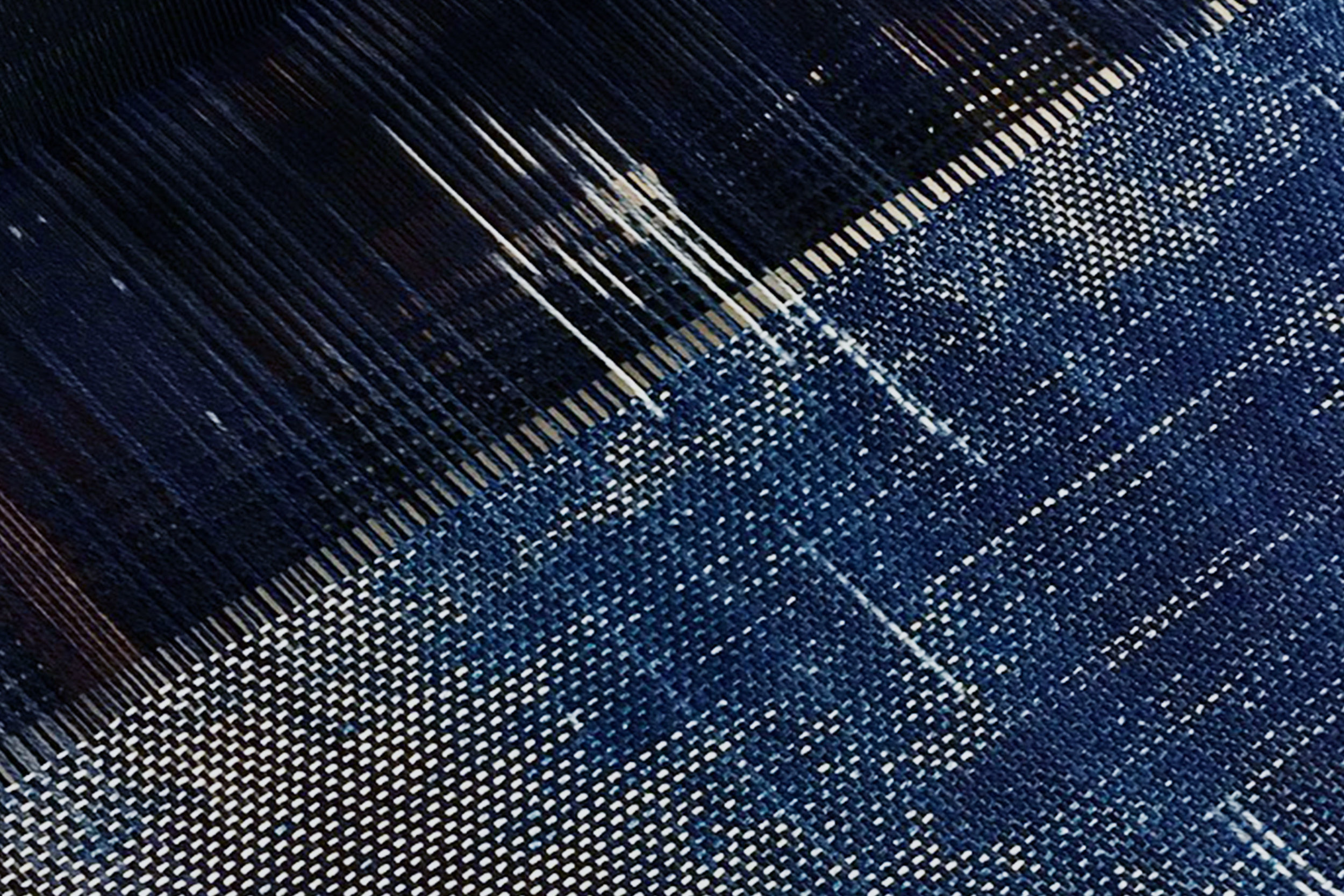 Close up/ Indigo Ikat dyed warp woven with cyanotype wefts