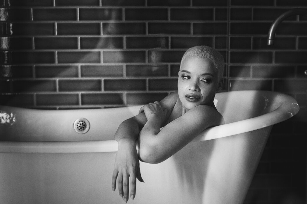 woman sitting in bathtub - seeing your true self on valentine's day