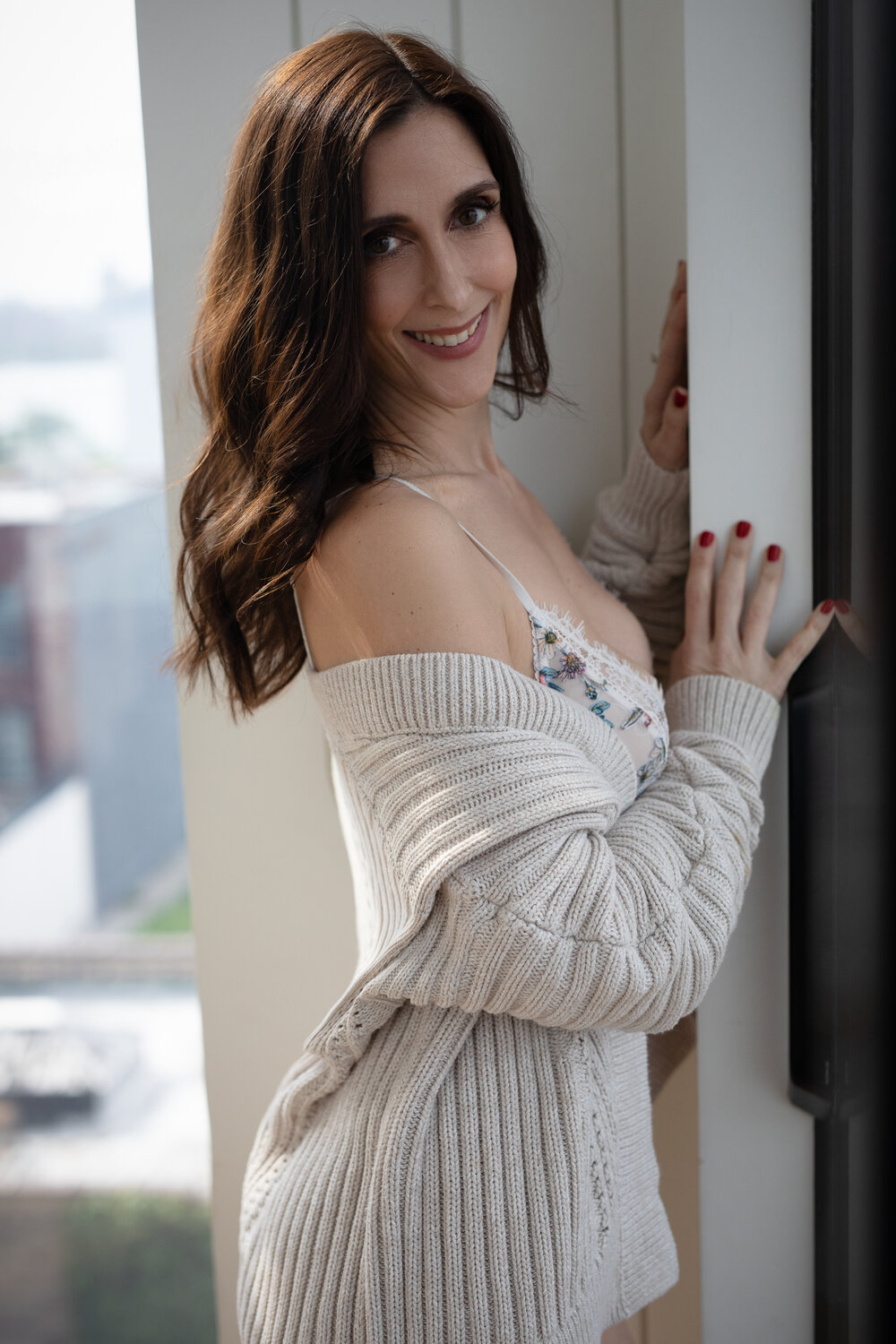 woman in cream sweater  - why you need boudoir more than ever