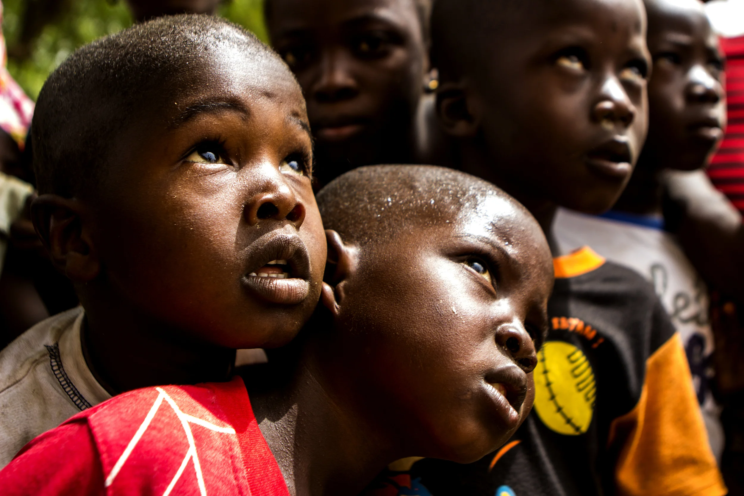 Yola, Nigeria. March 5 2015. Two children wait in line for lunch at an informal camp for internally displaced persons (IDPs) in an empty school building.