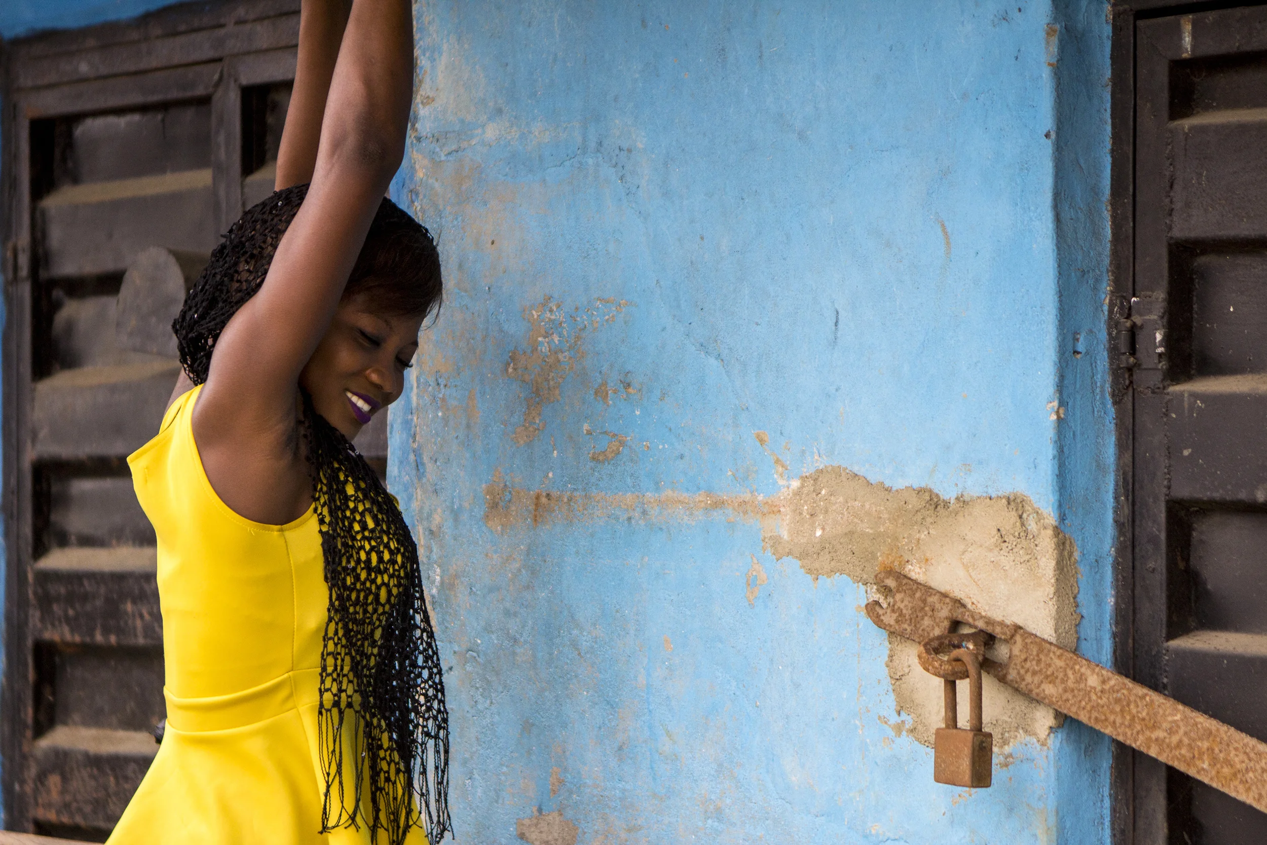 A business owner in Lagos, Nigeria opens her shop for business on Feb. 25, 2015. 