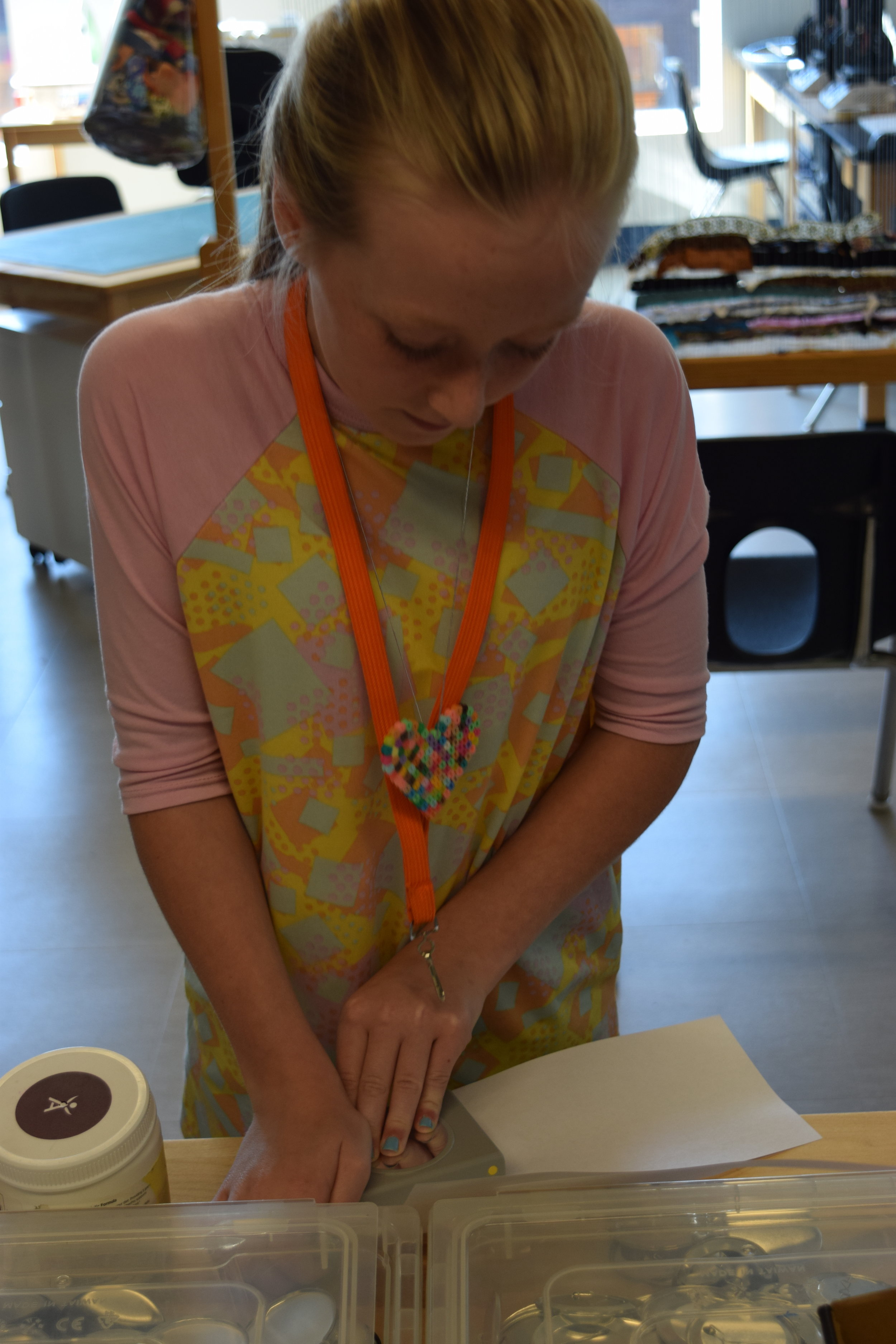Tess making Buttons