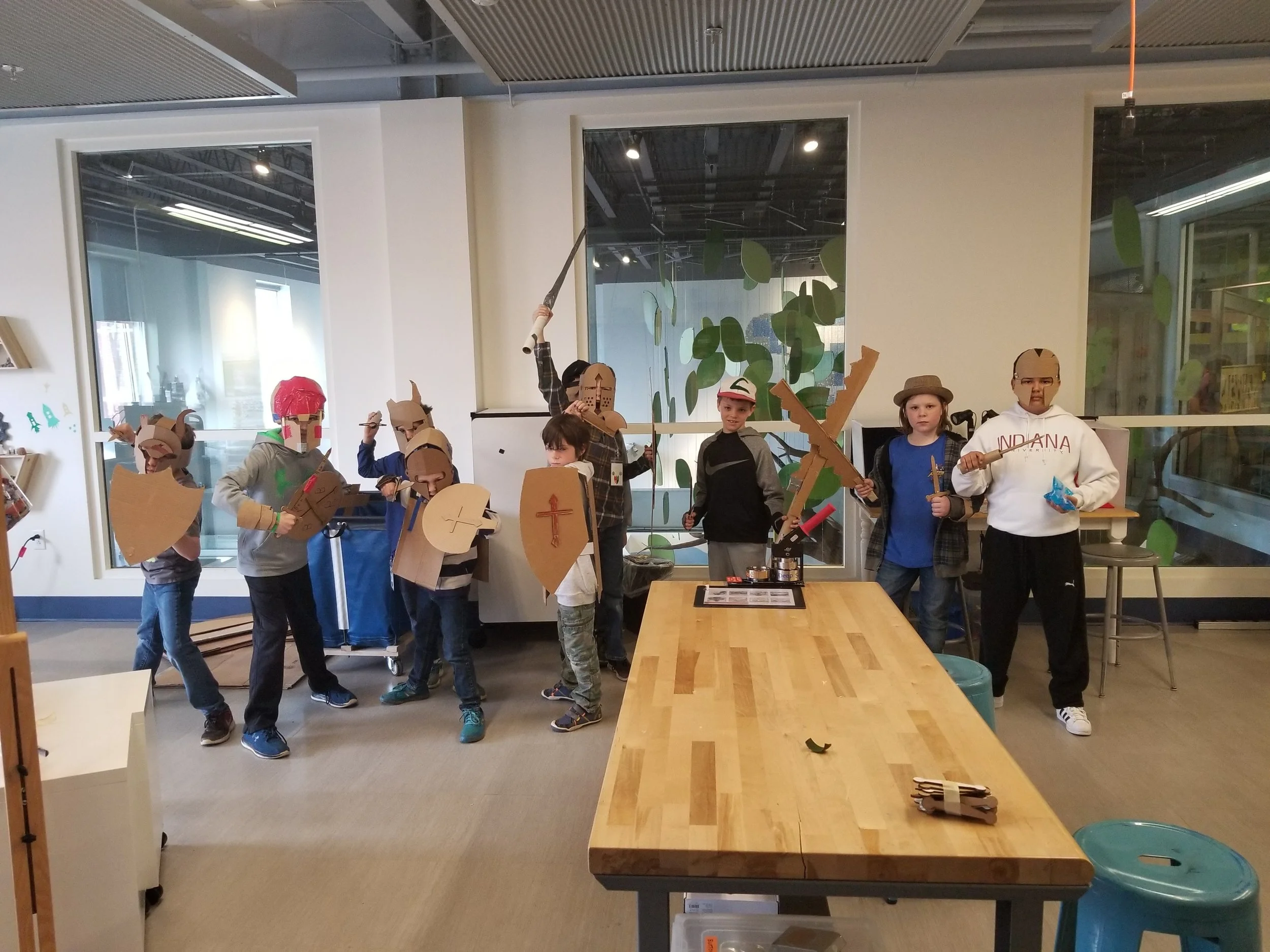 Makers showing off their cardboard armor creations.