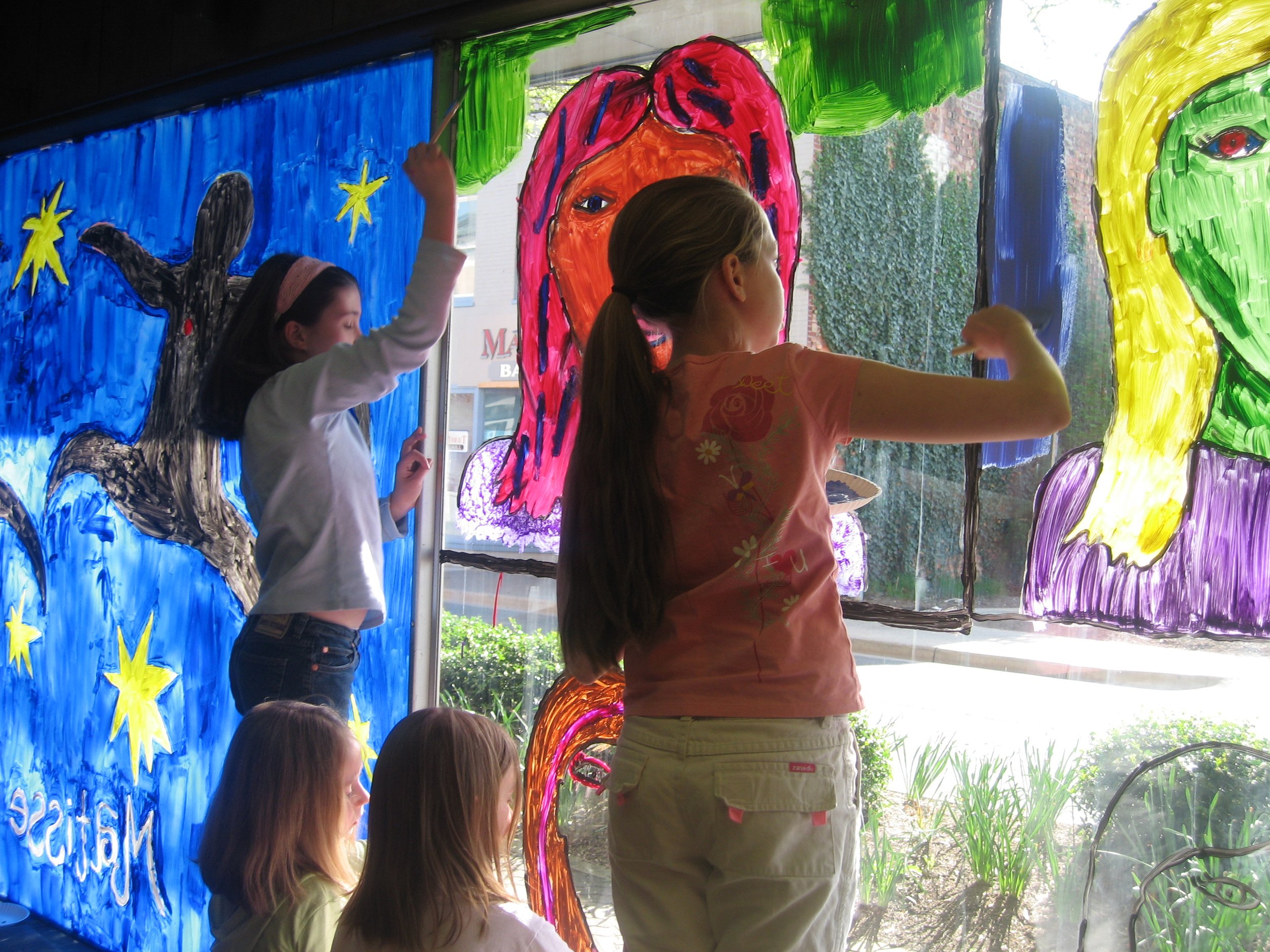  Before the Museum had funds to renovate its permanent home, it sat empty. Kids painted murals in the vacant storefront windows to provide visual interest for downtown visitors.  