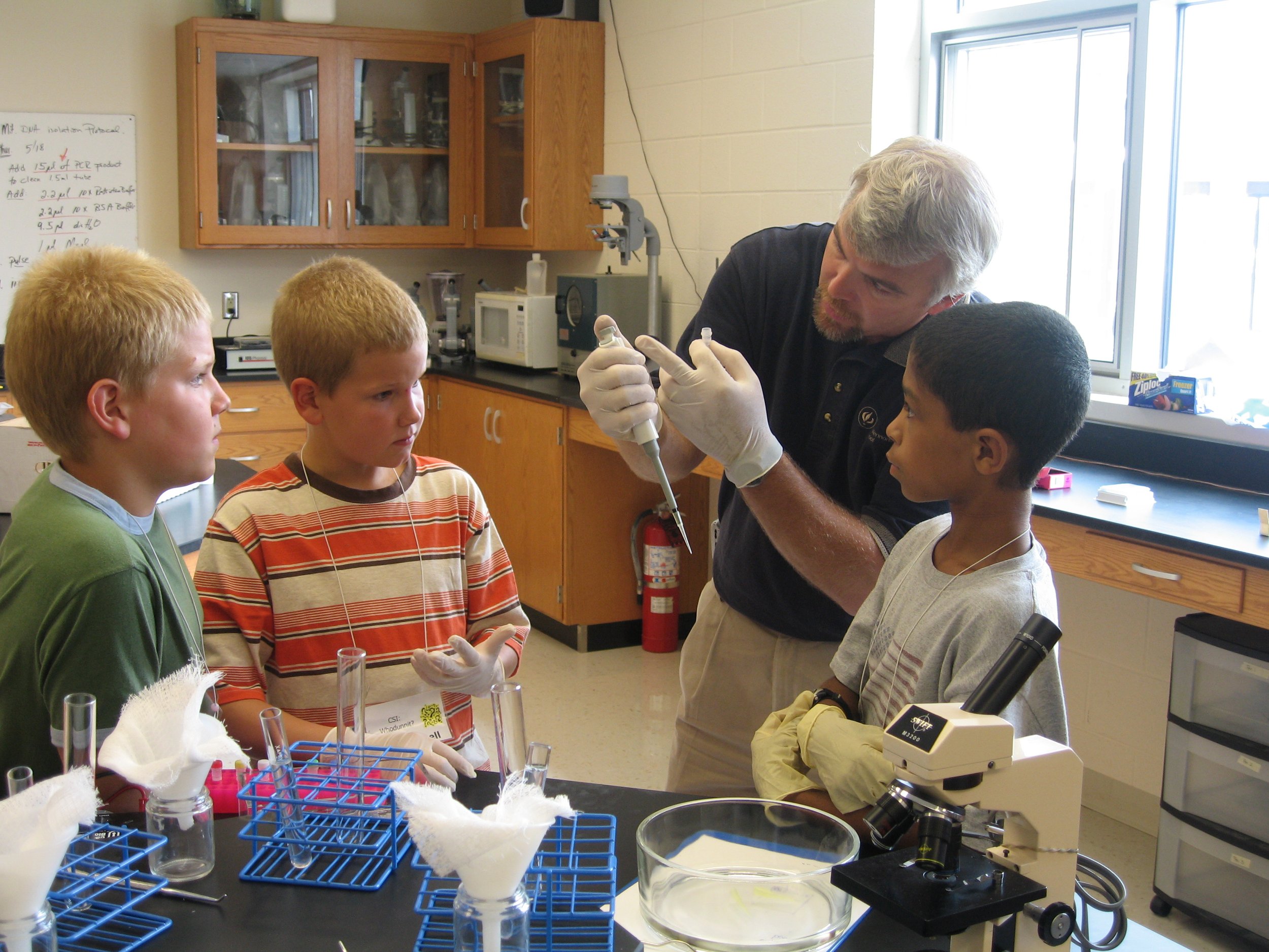  Local science educator Myron Blosser leads a CSI camp during the summer.  