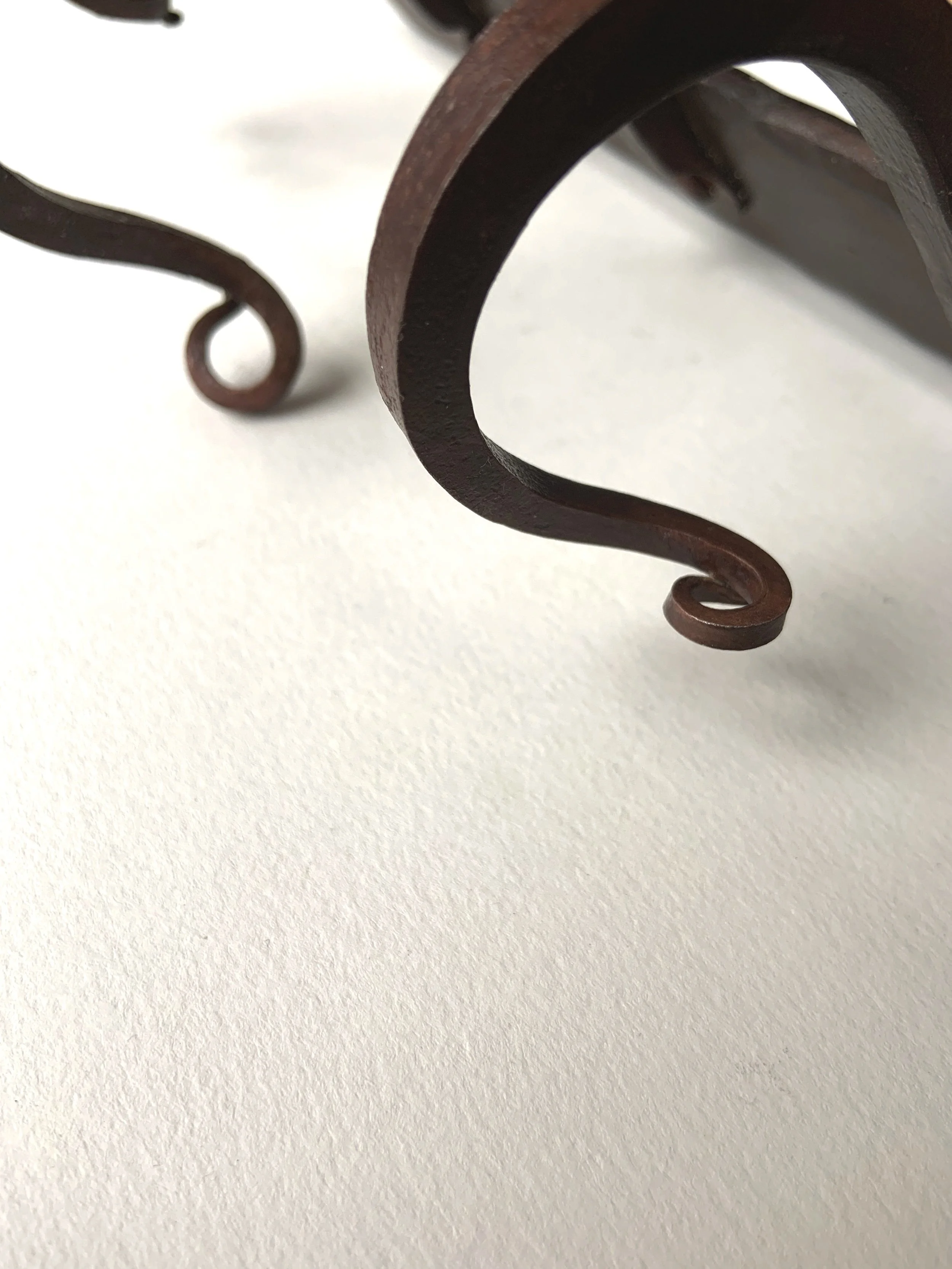 Close up of decorative touches on the hooks.
