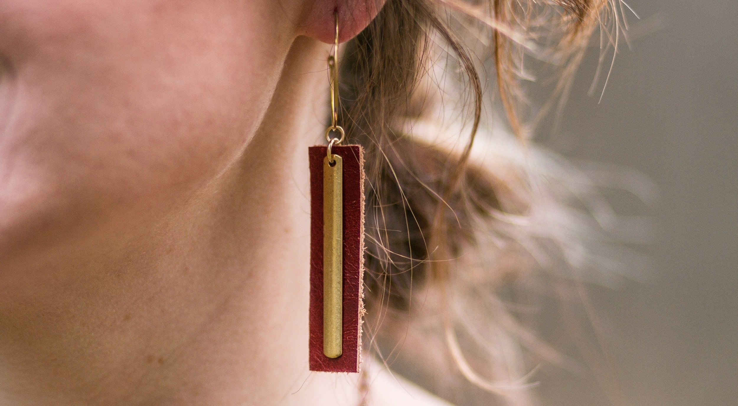 Photo of “The Dressember” earrings created for the Dressember 2018 Campaign.