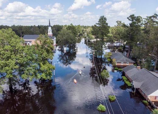 PHOTO: Kayaks are paddled up Long Avenue past flooded sections of the Sherwood Drive community of Conway, S.C., Sunday, Sept. 23, 2018 after Hurricane Florence. Homes were submerged deeper than ever in flood waters that set historic records. Jason Lee, The Sun News via AP